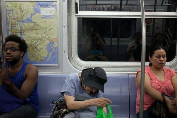 An elderly lady rides the subway in New York City. Joseph Amandola III © 2015